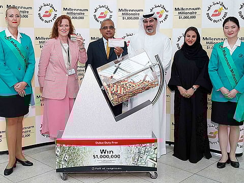 Dubai Duty Free officials pick the latest winner of $1 million.