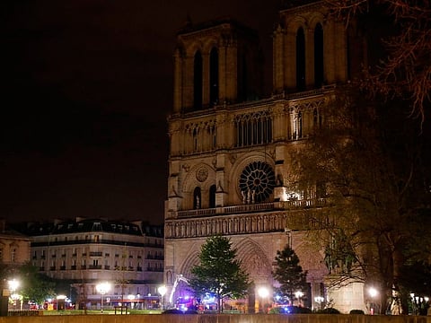 Firefighters are seen working in front of Notre-Dame Cathedral in Paris early on April 16, 2019. A huge fire that devastated Notre-Dame Cathedral is "under control", the Paris fire brigade said early April 16, 2019, after firefighters spent hours battling the flames.