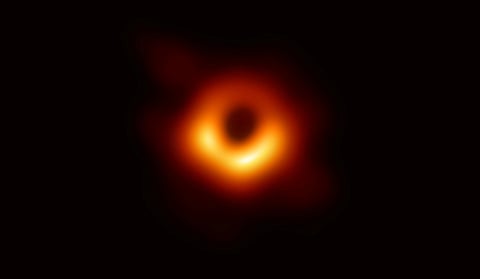 The first ever photo of a black hole, taken using a global network of telescopes, conducted by the Event Horizon Telescope (EHT) project, to gain insight into celestial objects with gravitational fields so strong that no matter or light can escape, is shown in this handout released April 10, 2019.