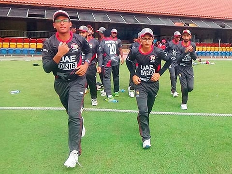 UAE team return to the pavilion after restricting Singapore to a small total in Kuala Lumpur.