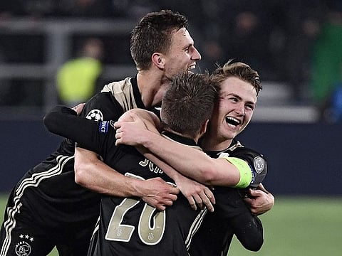 Ajax defender Joel Veltman, midfielder Lasse Schone and defender Matthijs de Ligt celebrate defeating Juventus.