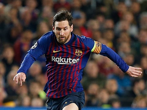 Barcelona forward Lionel Messi runs with the ball during the Champions League quarterfinal, second leg, soccer match between FC Barcelona and Manchester United at the Camp Nou stadium in Barcelona, Spain, Tuesday, April 16, 2019.
