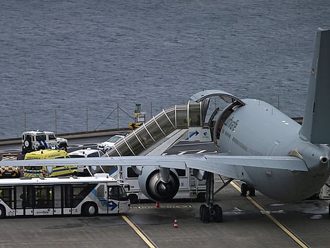 Ambulances parked around a German air force (Luftwaffe) plane at Madeira international airport in Funchal, the capital of Portugal's Madeira Island, Saturday April 20, 2019. The plane was due to take home some of the injured survivors in Wednesday's bus crash in Madeira.
