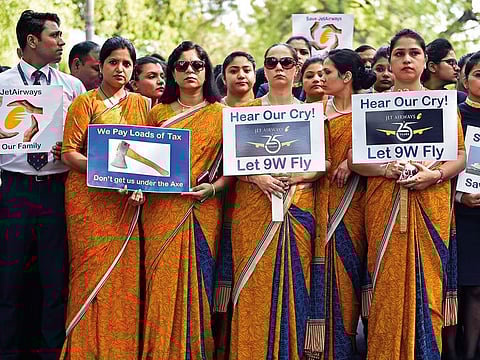 Cabin crew hold placards during a protest organided by Jet Airways employees at Jantar Mantar in Delhi. Collapse of Jet Airways threatens the loss of about 23,000 jobs.