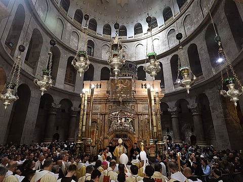 Apostolic Administrator of the Latin Patriarch of Jerusalem, Pierbattista Pizaballa (C), leads the Easter Sunday procession at the Church of the Holy Sepulchre in Jerusalem's Old City