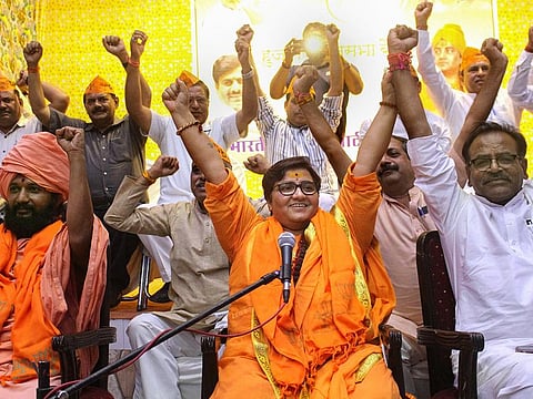 BJP candidate Sadhvi Pragya Singh Thakur gestures while addressing a party workers' meeting for Lok Sabha polls, in Bhopal.
