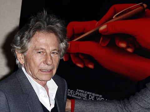 Director Roman Polanski poses during a photo call prior to the screening of "Based on a true story" in Paris, France, Monday Oct. 30, 2017. France's famed film institute La Cinematheque Francaise says it will go ahead with a retrospective of works by director Roman Polanski despite opposition by feminist groups, in regard to the Polish-born director who in the 1970s pleaded guilty to having sex in the U.S. with a 13-year-old girl whom he plied with champagne and Quaaludes. (AP Photo/Francois Mori)