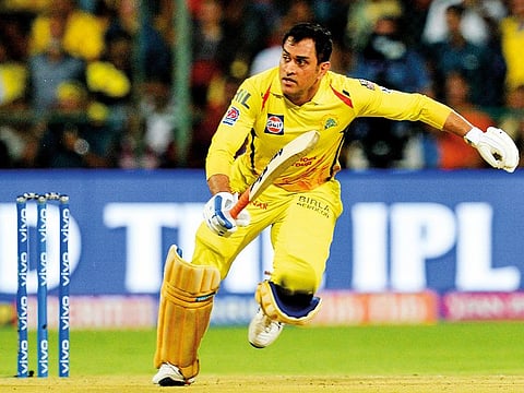 Chennai Super Kings skipper Mahendra Singh Dhoni scampers for a single during his unbeaten 84 against Royal Challengers Bangalore on Sunday.
