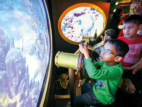 Children can board the submarine and take control at the helm, peer through the periscope and crank the propeller.