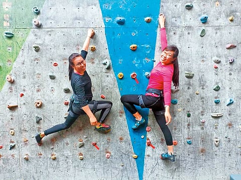Furdiki Sherpa and Nima Doma Sherpa (right), two Nepali widows attempting to summit Mount Everest, during wall climbing training in Kathmandu.
