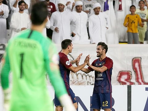 Al Wahda's Leonardo De Souza (right) celebrates after scoring a goal during the AFC Champions League group B football match against Qatar's Al Rayyan at the Al Nahyan Stadium in Abu Dhabi on April 22, 2019.
