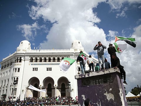 In this Wednesday, April 10, 2019 photo, young Algerians take part in a demonstration against the country's leadership in Algiers, Algeria. They’re on the peaceful frontline of the protest movement that toppled Algeria’s longtime ruler, facing down water cannons with attitude, memes _ and fearless calls for shampoo. Two-thirds of Algeria’s population has no recollection of any leader other than former-President Abdelaziz Bouteflika, who has been driven out of the post he’d held since 1999 following nationwide protests since mid-February. (AP Photo/Mosa'ab Elshamy)
