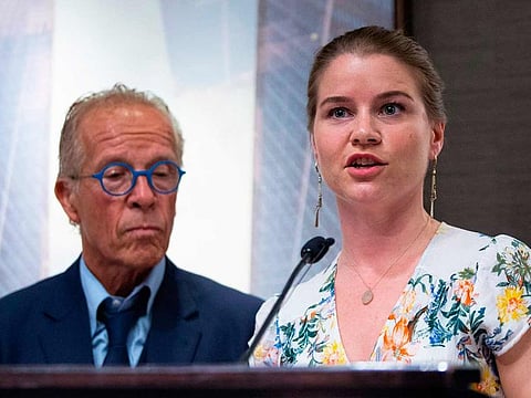 Victims' rights Attorney Jeff Anderson (L) listens as Bridie Farrell, a survivor of abuse and co-founder of NY Loves Kids, speaks at a press conference on April 23, 2019, in New York.