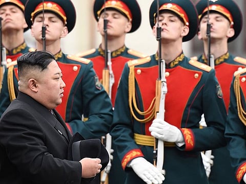 North Korean leader Kim Jong Un walks past honour guards during a welcoming ceremony upon arrival at the railway station in the far-eastern Russian port of Vladivostok on April 24, 2019.