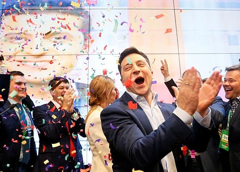 Ukrainian presidential candidate Volodymyr Zelenskiy reacts following the announcement of the first exit poll in a presidential election at his campaign headquarters in Kiev, Ukraine April 21, 2019.