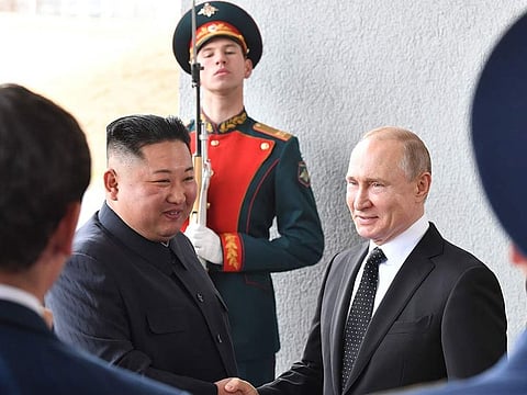 Russian President Vladimir Putin welcomes North Korean leader Kim Jong Un prior to their talks at the Far Eastern Federal University campus on Russky island in the far-eastern Russian port of Vladivostok on April 25, 2019.