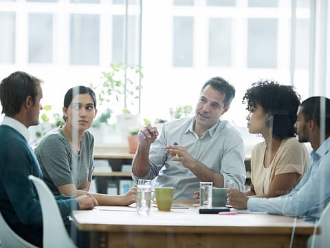 Cropped shot of a group of business colleagues meeting in the boardroom