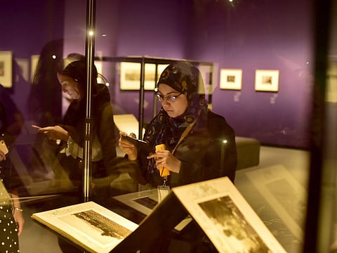 Visitors enjoy the photography exhibition Photographs 1842-1896: An Early Album of The World on display at the Lourve Abu Dhabi on 23rd April, 2019. Photo Clint Egbert/Gulf News