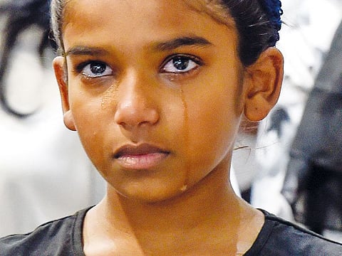 A member of the Sri Lankan community reacts during a special prayer service at St. Mary’s church in Dubai.