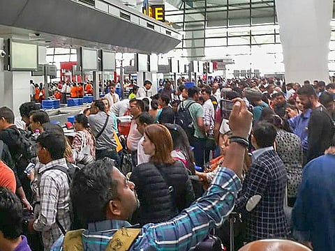 Air India flight passengers stranded at the Indira Gandhi International Airport, in New Delhi, on Saturday, April 27, 2019.