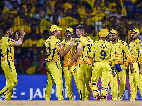 Chennai Super Kings bowler Mitchell Santner celebrates with teammates after dismissing Mumbai Indians batsman Evin Lewis during the IPL match between them, at MAC Stadium in Chennai, Friday, April 26, 2019.