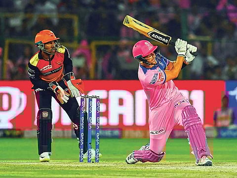 Rajasthan Royals batsman Liam Livingstone (R) plays a shot as Sunrisers Hyderabad wicket keeper Wriddhiman Saha (L) looks on during the 2019 Indian Premier League (IPL) Twenty20 cricket match between Rajasthan Royals and Sunrisers Hyderabad at the Sawai Mansingh Stadium in Jaipur on April 27, 2019.