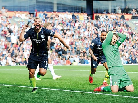 Manchester City’s Sergio Aguero (left) celebrates after scoring his side’s opening goal during the Premier League match against Burnley at Turf Moor in Burnley on Sunday.