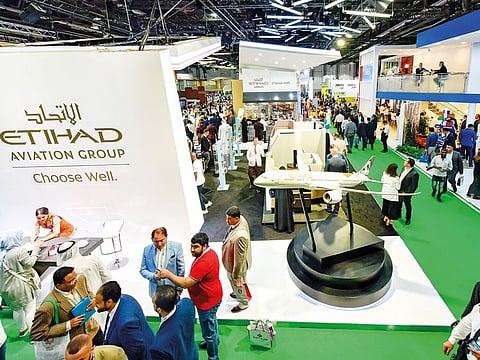 People at Etihad Airways at Arabian Travel Market 2019.