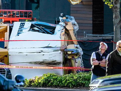 Police investigate the scene of a construction crane collapse near the intersection of Mercer Street and Fairview Avenue Saturday, April 27, 2019, in Seattle. Several people died and others were injured when a construction crane on the new Google Seattle campus collapsed Saturday, pinning cars underneath.