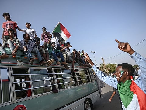 Sudanese protesters arrive to join the sit-in outside the army headquarters in the capital Khartoum on April 27, 2019.