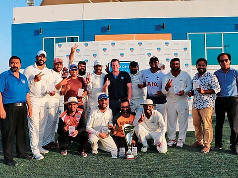 White Hunters team pose with the winners trophy.