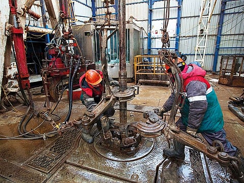 Workers at an oil rig in Tatarstan, Russia. Although the pandemic will continue to weigh on oil demand in 2021, some estimates show that monthly supply deficits could reach their highest in years.