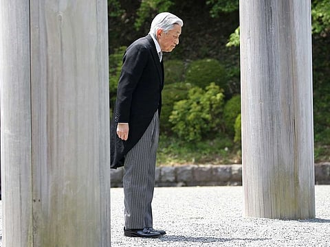 Japan's Emperor Akihito arrives at the tomb of his late father Hirohito to report his abdication at the Musashino Imperial Mausoleum in Tokyo.