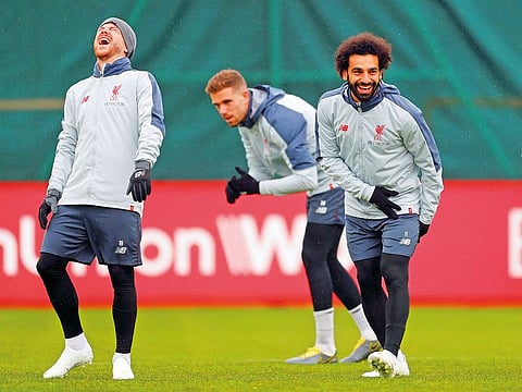 Liverpool's Mohammad Salah with Alberto Moreno during training.