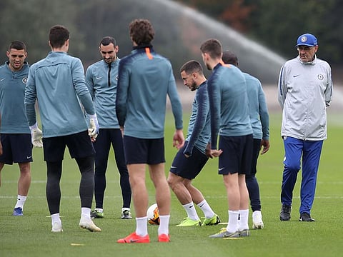Chelsea manager Maurizio Sarri (right) looks on during a training session at Cobham Training Ground outside London, Wednesday, May 1, 2019.