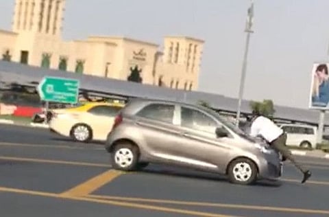 Woman in Dubai who drove off with valet parking staff on bonnet charged with endangering his life