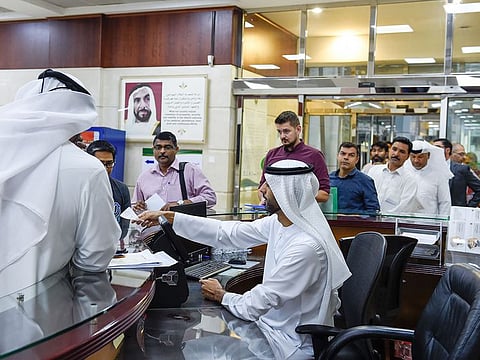 Employees at work at the General Directorate of Residency and Foreign Affairs (GDRFA) in Dubai. Picture for illustrative purposes only.