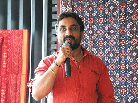 Rahul Vinayak Salvi speaking on Patan Patola during a colloquium in Dubai.