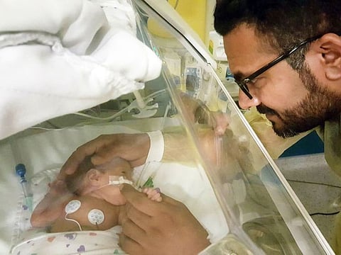 Baby Evelyn with her father.