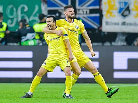 Chelsea's Spanish midfielder Pedro (L) celebrates scoring the equaliser with his teammate French striker Olivier Giroud.