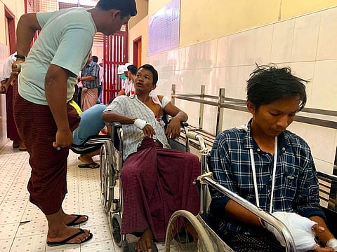 Injured people from Kyauk Tan village in Rathedaung township wait in a hospital in Rakhine state's capital Sittwe in western Myanmar on May 2, 2019, after the army opened fire on a group of ethnic Rakhine detainees at a school in the village.
