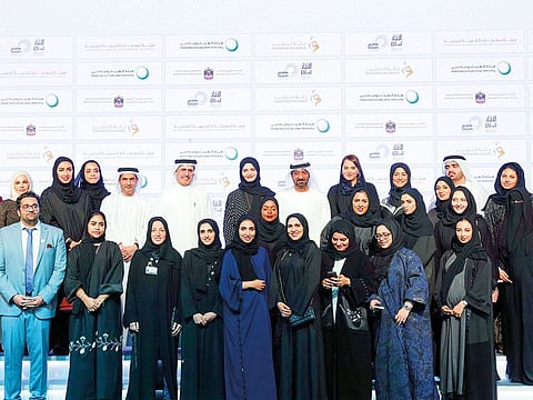 Shaikh Ahmad and Saeed Mohammad Al Tayer with the winners of the 13th Conservation Award, which honours educational institutions that implement best practices in saving energy.