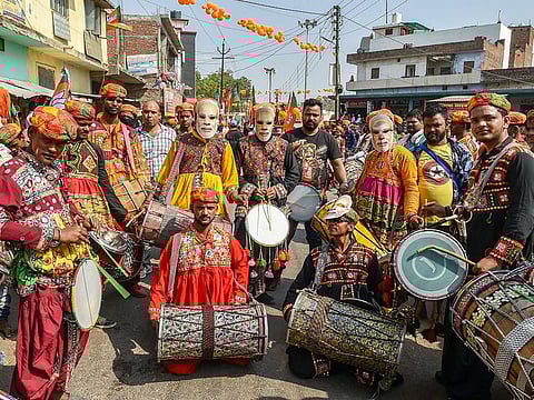 BJP supporters participate in a election roadshow by National President Amit Shah in support of party's candidate from Amethi seat Smriti Irani for Lok Sabha polls, in Amethi, Saturday, May 3, 2019.
