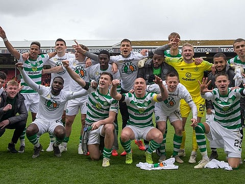 Celtic players celebrate after the final whistle of their Scottish Premiership football match against Aberdeen at Pittodrie Stadium, Aberdeen, Scotland, Saturday, May 4, 2019.