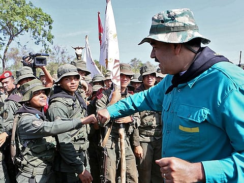 Venezuela's President Nicolas Maduro (R) greeting troop members during military exercises of cadets of the Bolivarian Military University at a training center in El Pao, Cojedes state, Venezuela on May 4, 2019.