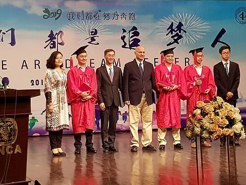 Chinese Ambassador to Pakistan, Yao Jing, and Senator Mushahid Hussain, giving awards to the Chinese graduates.