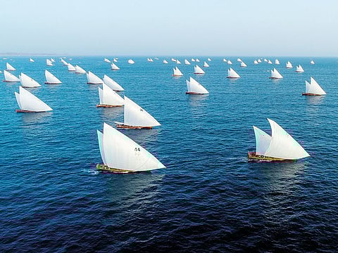 Dhows participate in the 29th Al Gaffal traditional dhow race near the island of Sir Bu Nair.