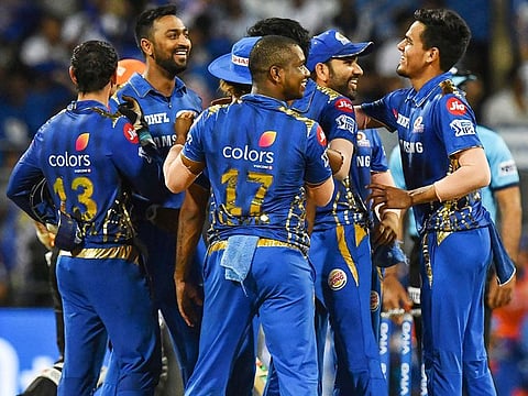 Mumbai Indians cricketers celebrate the dismissal of Sunrisers Hyderabad's Kane Williamson during the IPL match between them at the The Wankhede Stadium cricket stadium in Mumbai on May 2, 2019.