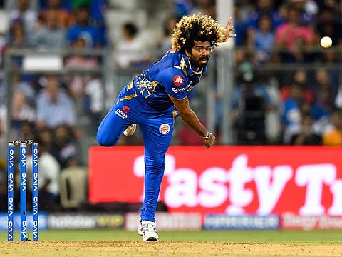 Mumbai Indians player Lasith Malinga bowls during the 2019 Indian Premier League (IPL) Twenty20 cricket match between Mumbai Indians and Kolkata Knight Riders at the Wankhede Stadium in Mumbai on May 5, 2019.