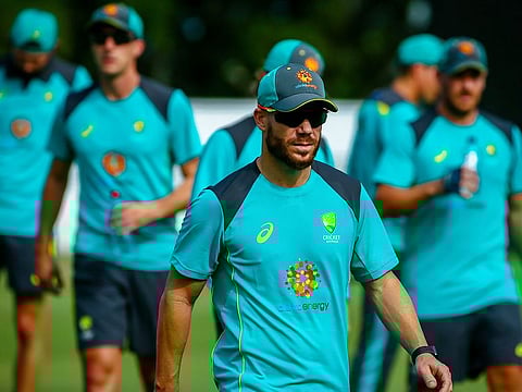 Australia's David Warner (C) takes part in a cricket training session in the Albion suburb of Brisbane.